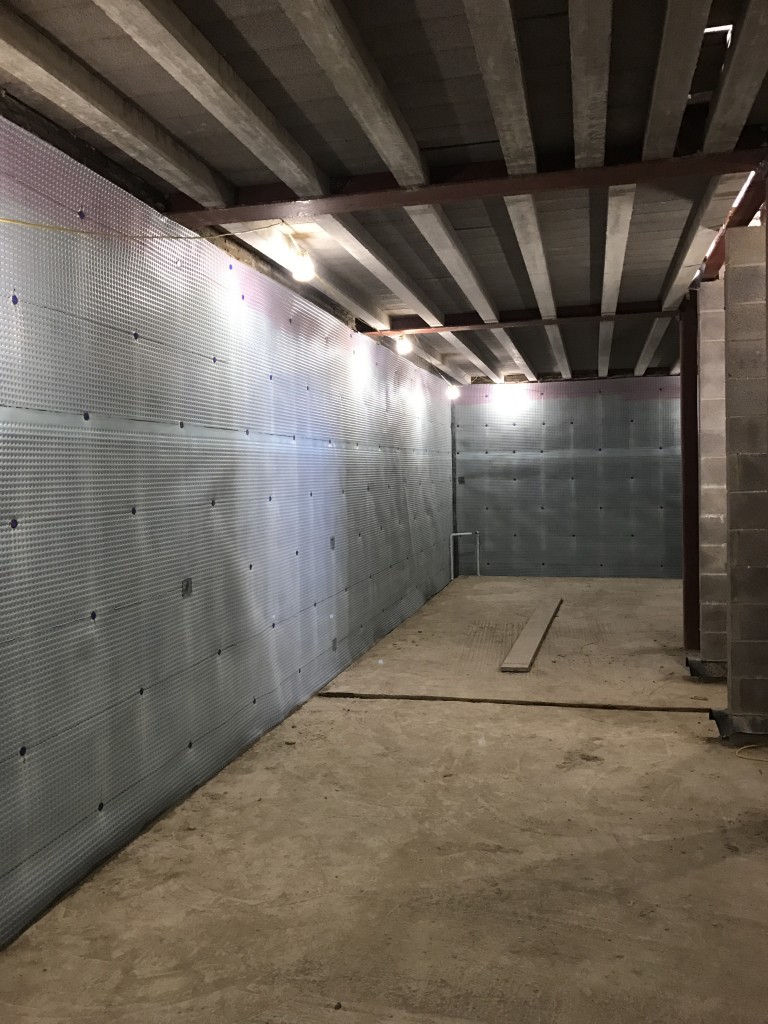 Walls lined with cavity drainage membrane